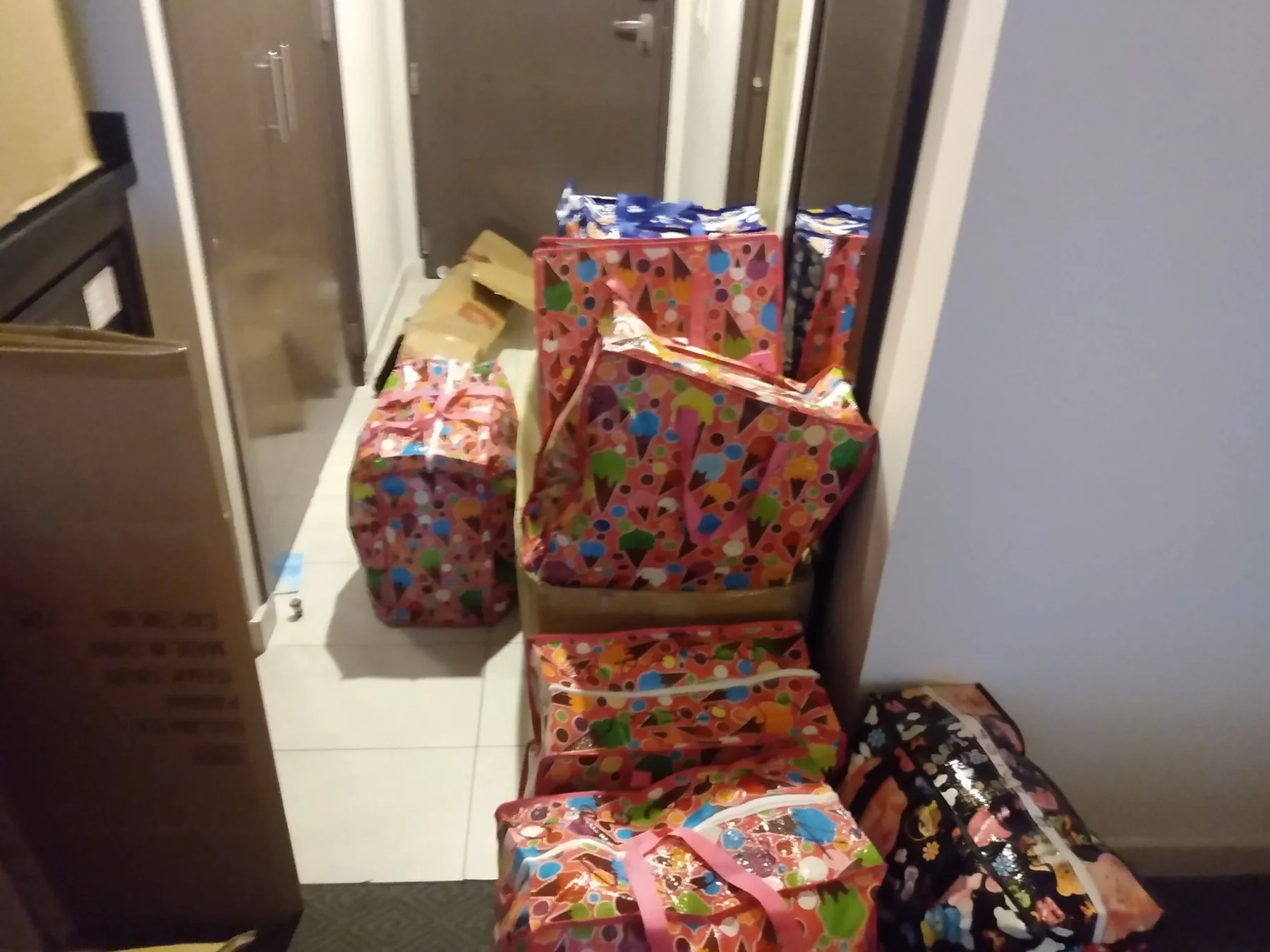 Wrapped Christmas gifts organized in a hotel room